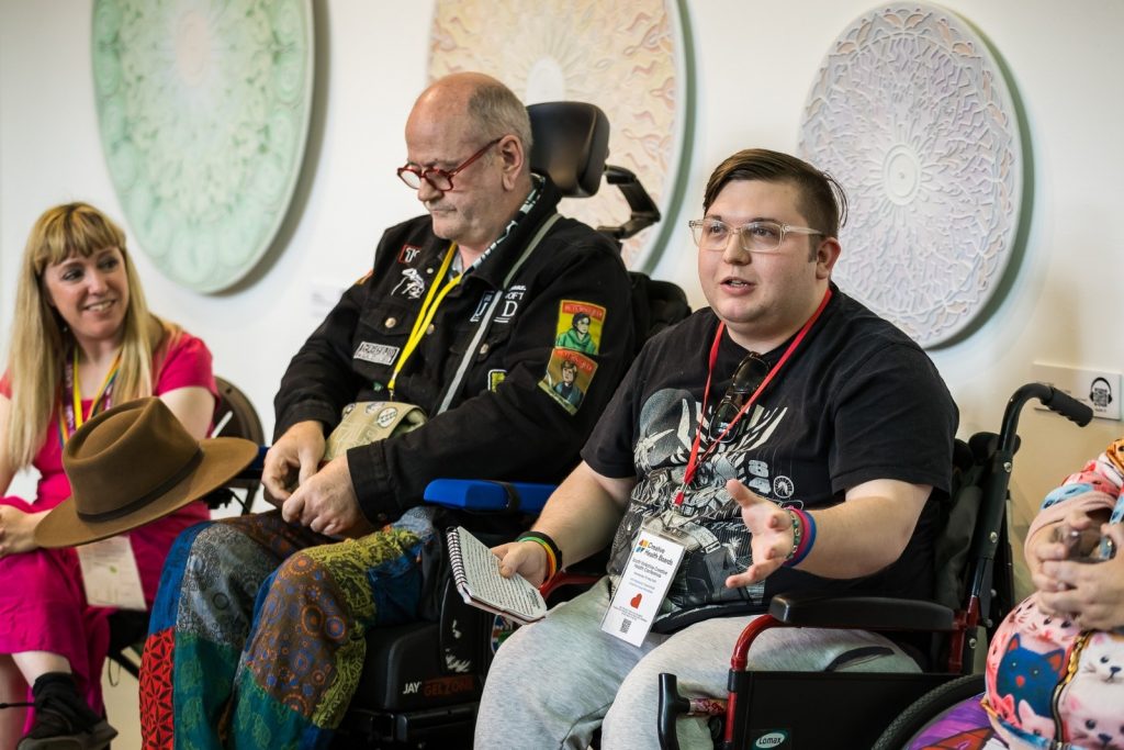 A group of people sitting in wheelchairs
