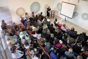 a room full of people at a conference